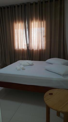 Postel nebo postele na pokoji v ubytování Solar das Sabiás Harmonia com a Natureza