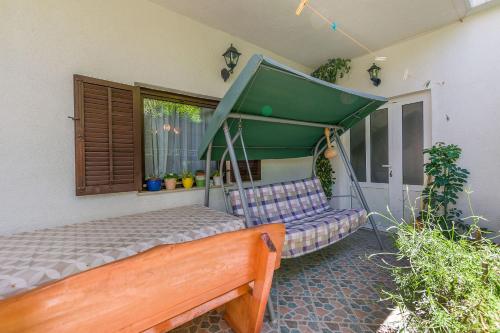 a bedroom with a bed and a canopy at Apartment Anica in Omiš