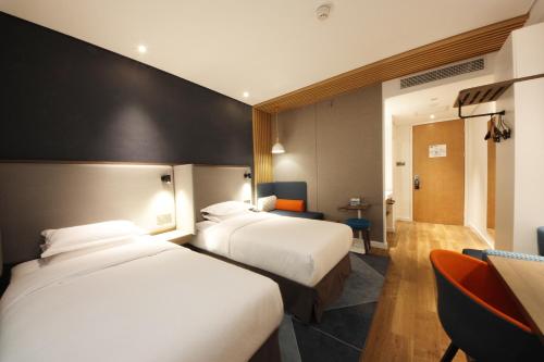 Katil atau katil-katil dalam bilik di Holiday Inn Express Hefei Shushan by IHG