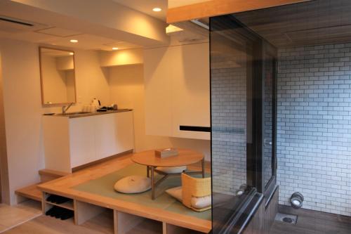 a bathroom with a sink and a toilet at Sakura Cross Hotel Akihabara in Tokyo