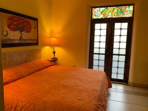 Una cama o camas en una habitación de Hotel Condominium La Posada de Bucerias
