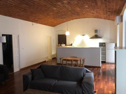 a living room with a couch and a table at Boulevard GRAZIANI in Bastia