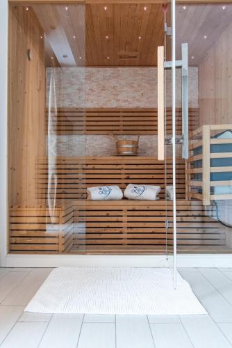 a glass door with two pillows in a room at Ludwig Boutique Hotel & Spa in Bolsena