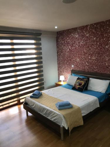 Un pat sau paturi într-o cameră la Ithaki Phinikoudes Apartment No. 207