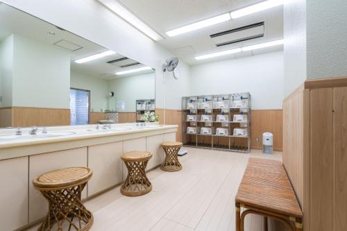 a bathroom with two sinks and two stools at Angel Resort Yuzawa in Yuzawa