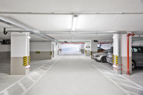 an empty parking garage with cars parked in it at Acta The Avenue in Porto
