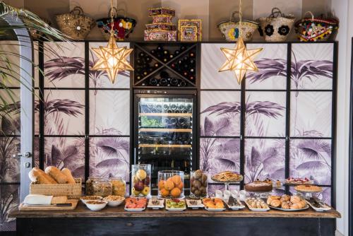 a bakery with a buffet of food on a table at Hotel Villa Ducale in Taormina