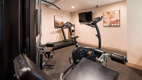 a gym with two tread machines in a room at Best Western Plus Newport Mesa Inn in Costa Mesa