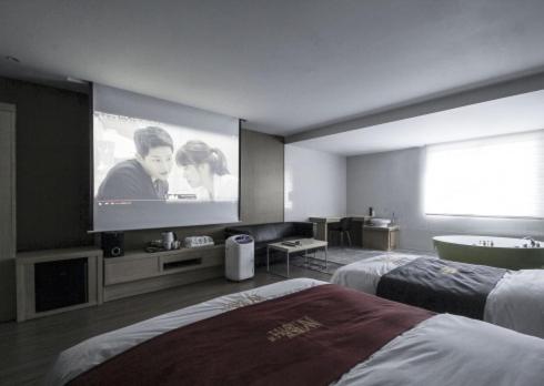 Säng eller sängar i ett rum på No.1 New Yorker Hotel