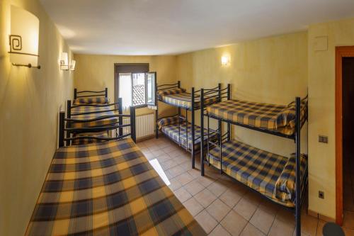Postel nebo postele na pokoji v ubytování ALBERGUE SAN SATURNINO