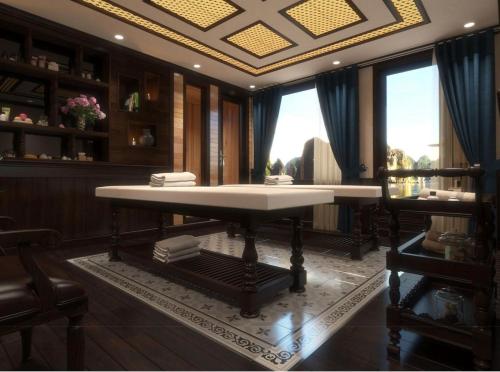 a dining room with a table in a room at Alisa Premier Cruise in Ha Long