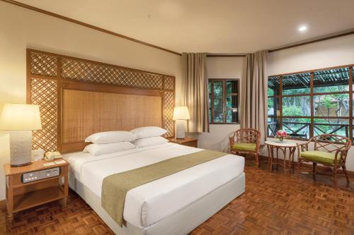 Ένα ή περισσότερα κρεβάτια σε δωμάτιο στο Regent - Chalet, Hua Hin