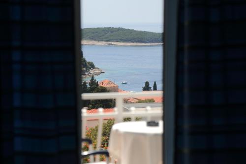 a view of the ocean from a balcony at Tanya-Apartments and Rooms in Hvar