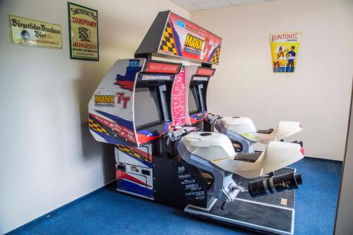a video game arcade with a large box at Parkhotel Harrachov in Harrachov