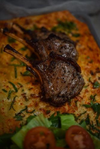 a piece of meat on top of a pizza at The Westist Hotel & Spa - Special Category in Istanbul