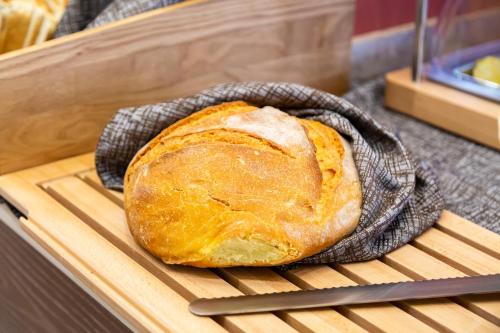 a loaf of bread sitting in a pan on a table at Best Western Hotel Imperiale in Nova Siri Marina
