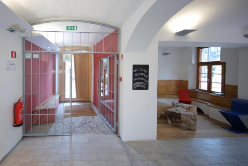 a hallway with a door leading into a room at Hostel Celica in Ljubljana