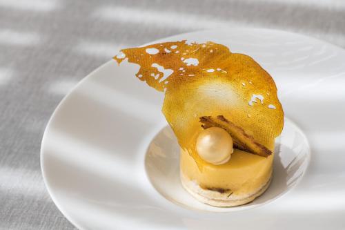 a dessert on a white plate on a table at Hostal Buenos Aires in Tremp