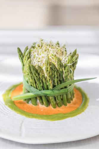 a plate of food with green beans and cheese at Hostal Buenos Aires in Tremp