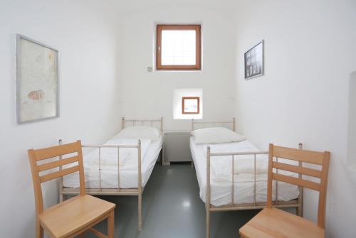 Postelja oz. postelje v sobi nastanitve Hostel Celica