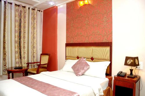 Postel nebo postele na pokoji v ubytování Hotel Kings Kastle