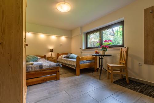 Posteľ alebo postele v izbe v ubytovaní Apartament Ewa