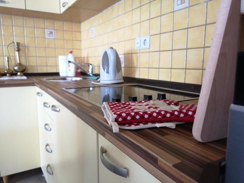 a kitchen counter with a sink and a towel on it at Apartment Imamović in Vogošća