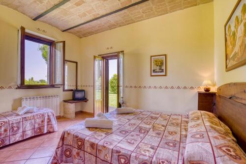 Posteľ alebo postele v izbe v ubytovaní Agriturismo Le Terre del Casale
