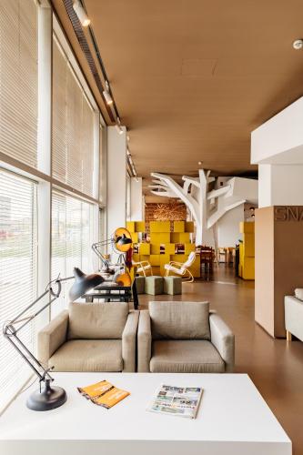 a living room with a couch and a table at Basic Braga by Axis in Braga