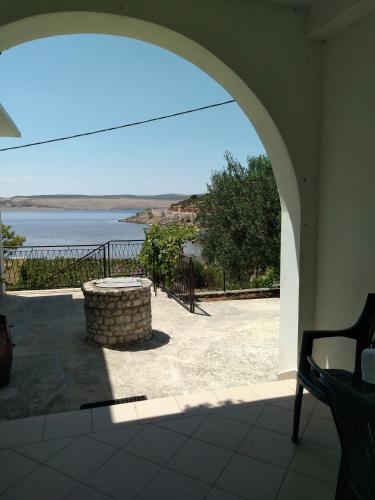 an archway in a house with a view of the water at Apartman Larus in Starigrad-Paklenica