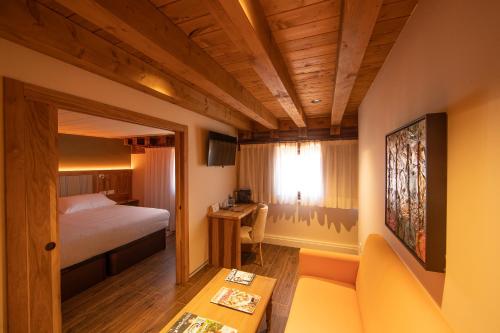 Postel nebo postele na pokoji v ubytování Camarote Hotel