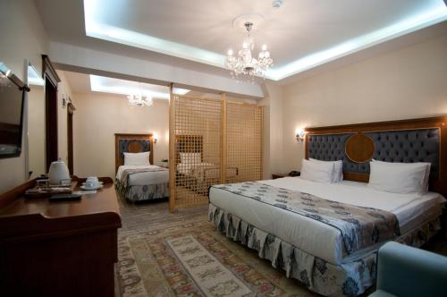 Säng eller sängar i ett rum på A'la Sofia Hotel İstanbul