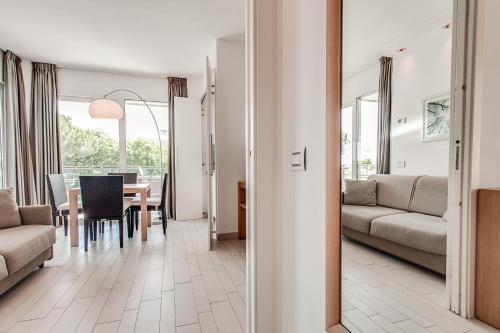a living room with a table and a couch at Kontiki in Milano Marittima