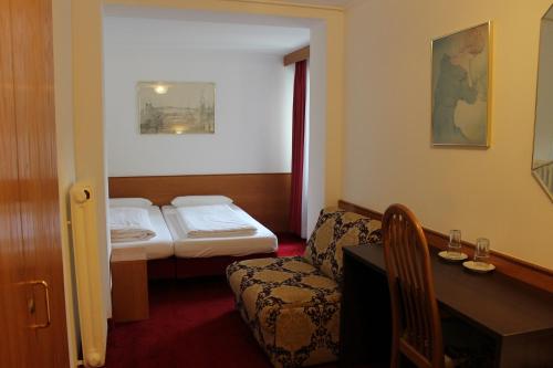 Un pat sau paturi într-o cameră la Hotel Montree