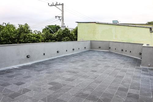 a patio on top of a building at Artsy Vitoria Hostel in Vitória