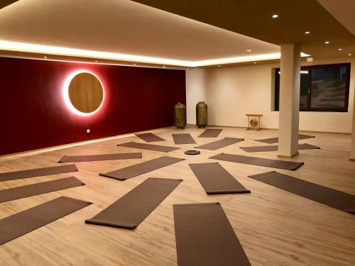 a room with yoga mats on the floor at B&B Boutique Apartment Oberwiesen in Brunico