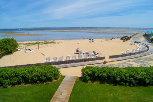 a beach with chairs and people on the sand at Provincetown Inn in Provincetown