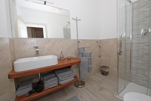 Koupelna v ubytování Appartamenti Via Garibaldi