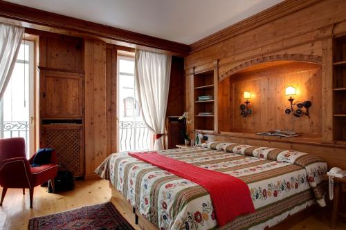 Кровать или кровати в номере Hotel Cortina