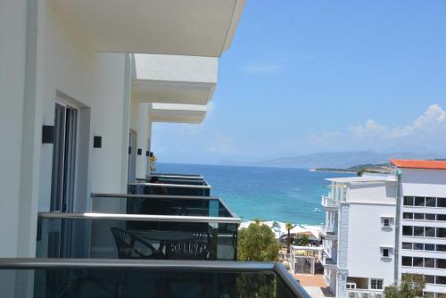 a view of the ocean from the balcony of a building at Summer Gate Hotel in Ksamil