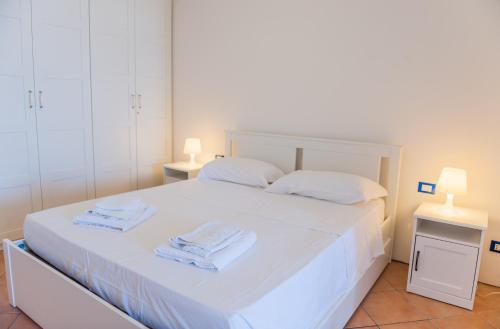 Una cama o camas en una habitación de Casita de Playa Marettimo