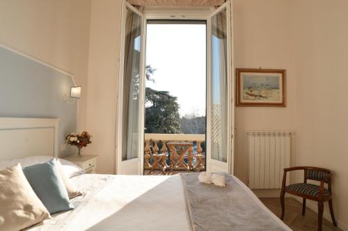 Postelja oz. postelje v sobi nastanitve Dimora Salviati
