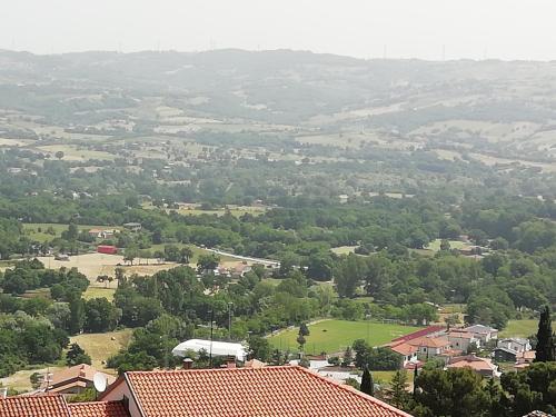 an aerial view of a town with houses and trees at B&B Murgantia in Morcone