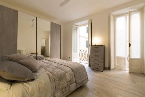 เตียงในห้องที่ Appartamenti Via Garibaldi