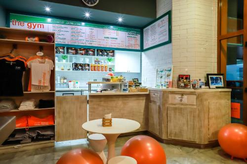 a fast food restaurant with a table and red balloons at Maya Villa Condo Hotel and Beachclub in Playa del Carmen
