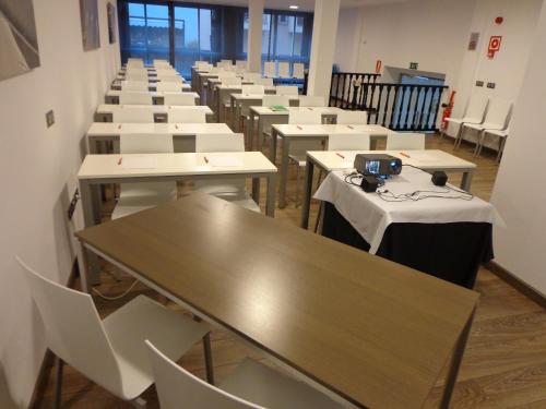 a row of tables and chairs in a classroom at Nautic Hotel & Spa in Can Pastilla