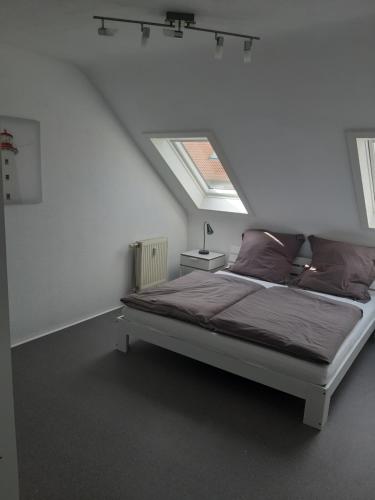 Llit o llits en una habitació de Ferienwohnung am Gehrenberg Bodenseeregion