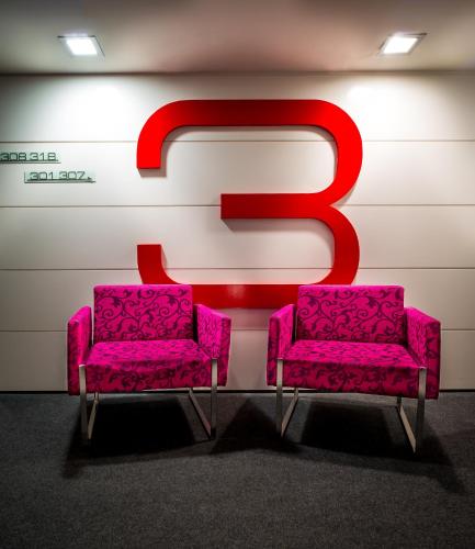 two pink chairs in front of a sign with the number five at Nautic Hotel & Spa in Can Pastilla