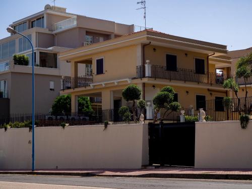 a house with a gate in front of it at Viaggio in Sicilia B&B in Gravina di Catania