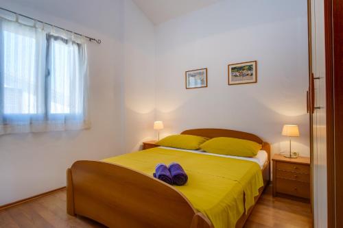 Posteľ alebo postele v izbe v ubytovaní Apartman Anamarija